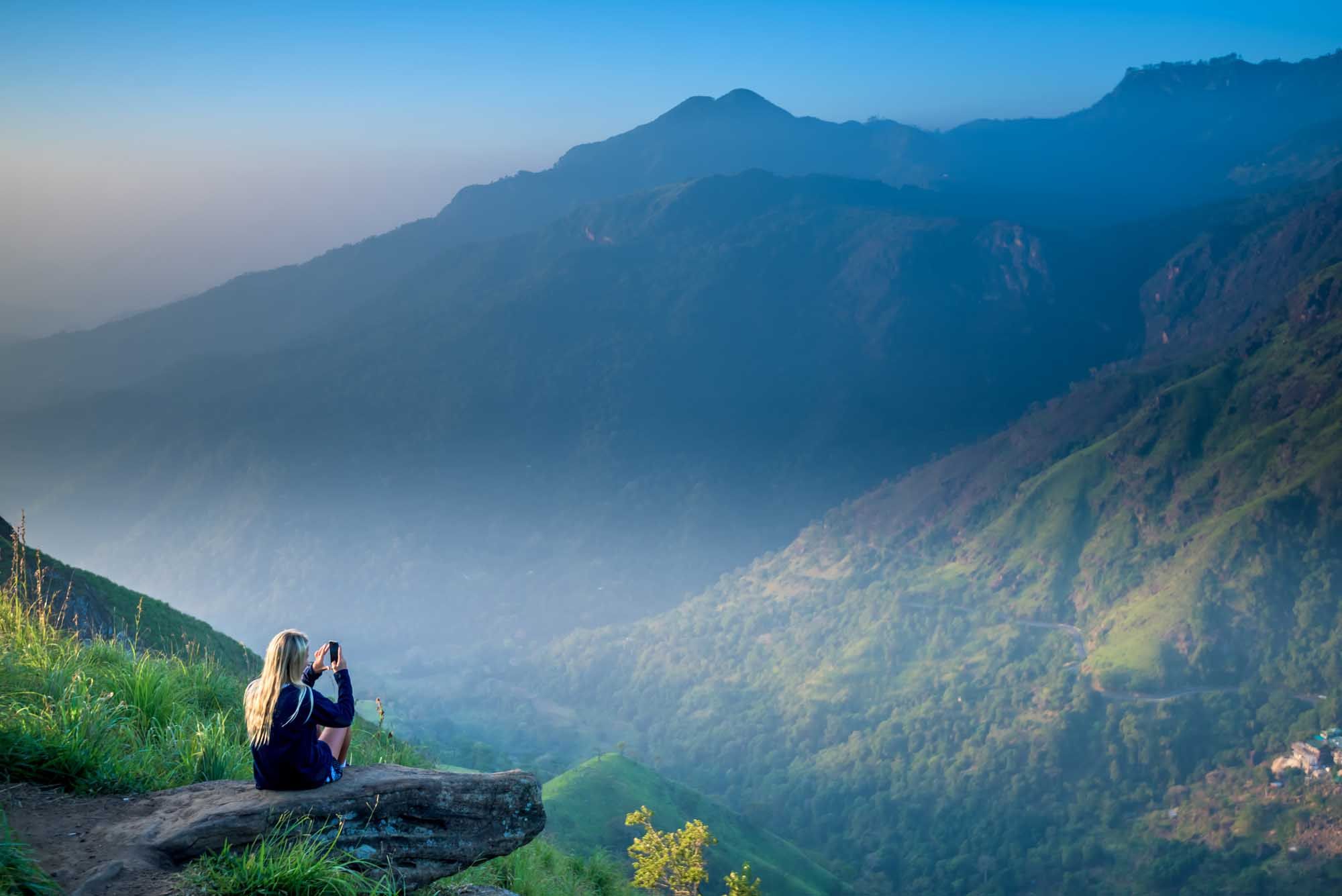 Tourist girl at beautiful landscape in Little Adams's peak, Ella, Srilanka