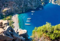Butterfly Valley (Turkish: Kelebekler Vadisi) is a valley in Fethiye district, Mugla Province, on the Mediterranean coast of Turkey. Oludeniz - Fethiye, Mugla, Turkey © Shutterstock