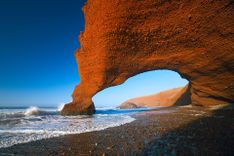 Legzira dramatic natural stone arches reaching over the sea, Atlantic Ocean, Morocco © Shutterstock