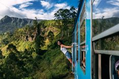 Girl leaning out of a train, Sri Lanka